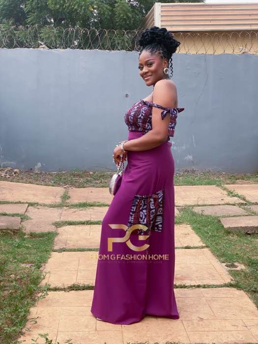 Purple off-shoulder Ankara maxi dress full-body outdoor pose by Prom G Fashion